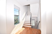 a staircase leading to a window in a home